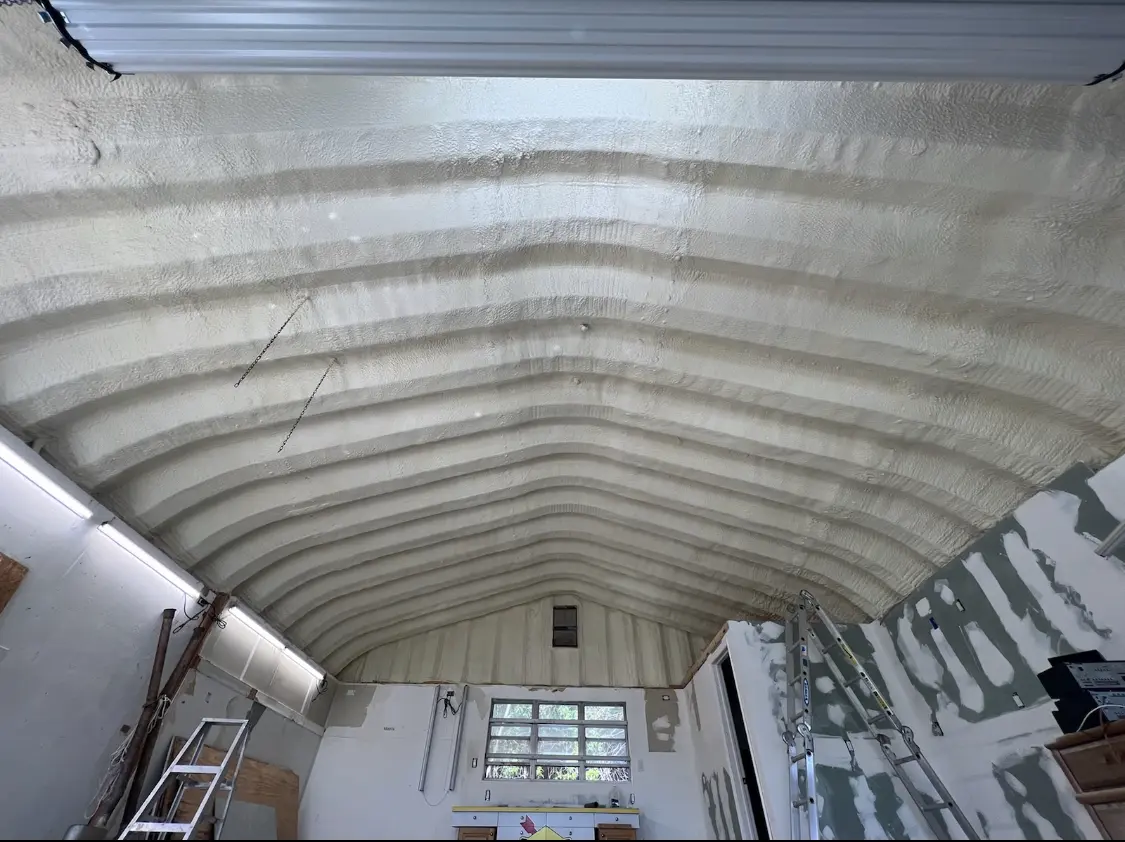 Spray polyurethane foam applied to the underside of a metal roof deck in Oak Forest